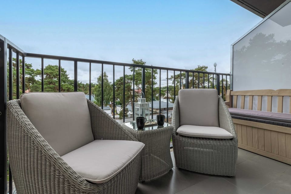 The balcony provides a serene environment for relaxation.