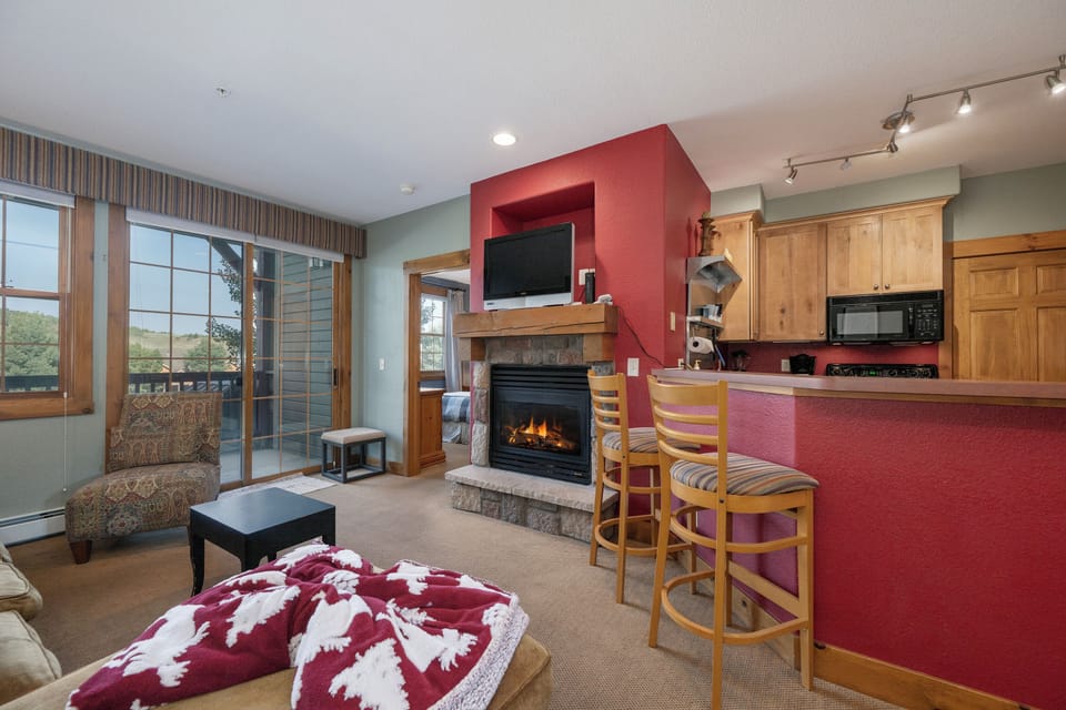 Cozy up by your fireplace at Kicking Horse Maverick 5-203 while dinner simmers in the full kitchen, then unwind with mountain views from your private balcony.
