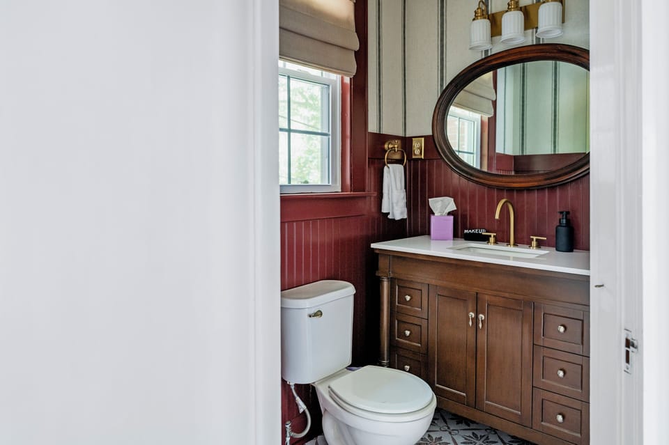 A conveniently located bathroom just off the main living and gathering spaces