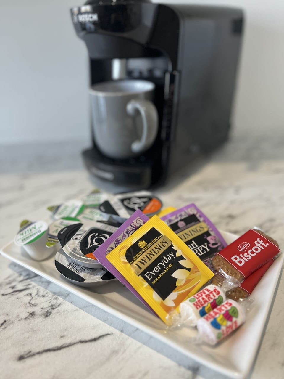 Tassimo coffee machine with complimentary coffee, tea, and refreshments.