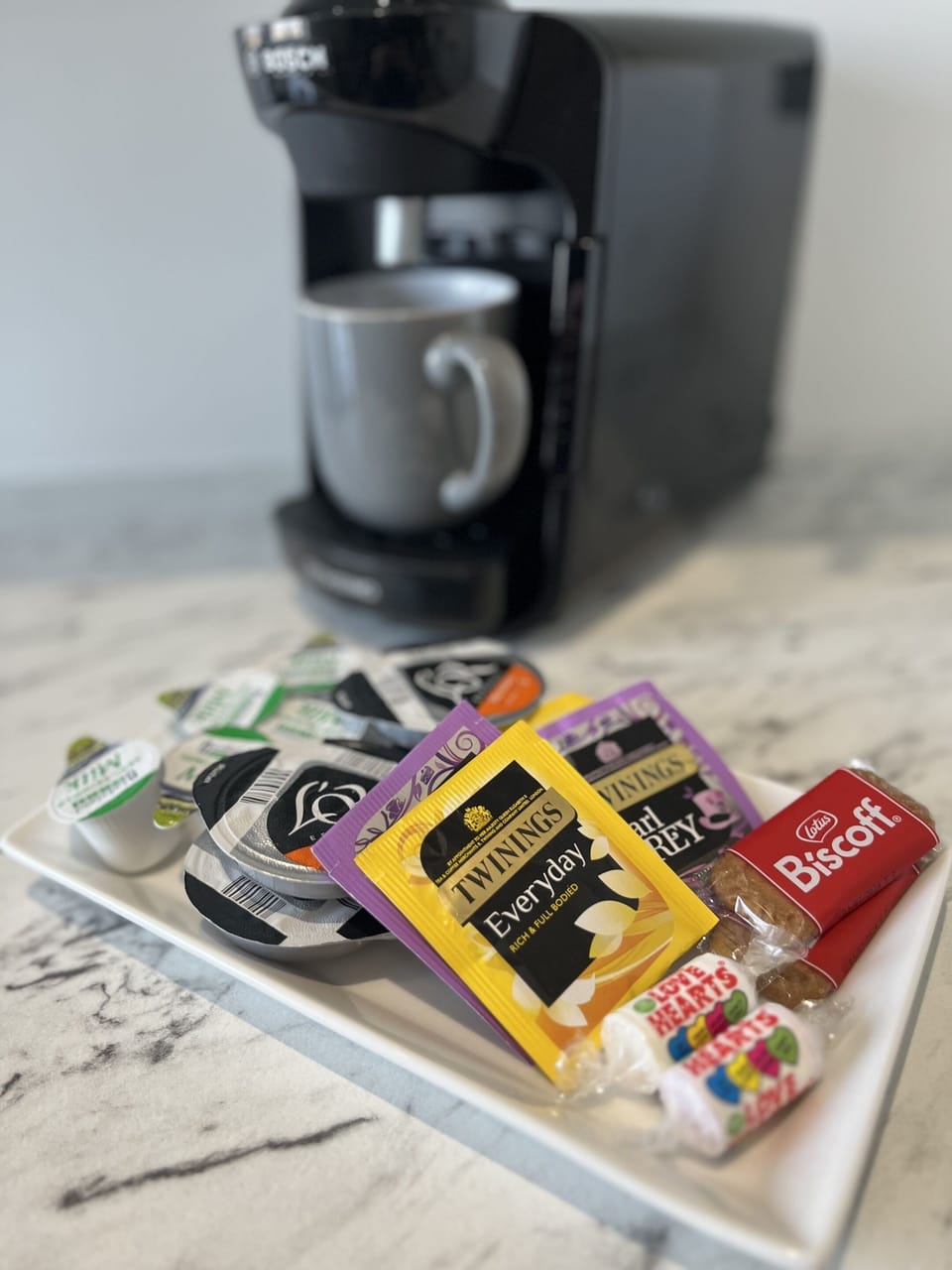 Tassimo coffee machine with complimentary coffee, tea, and refreshments.