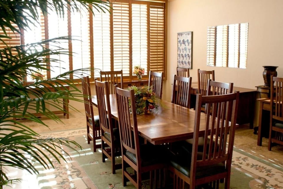 Gather for long meals at a sunlit, elegant table.