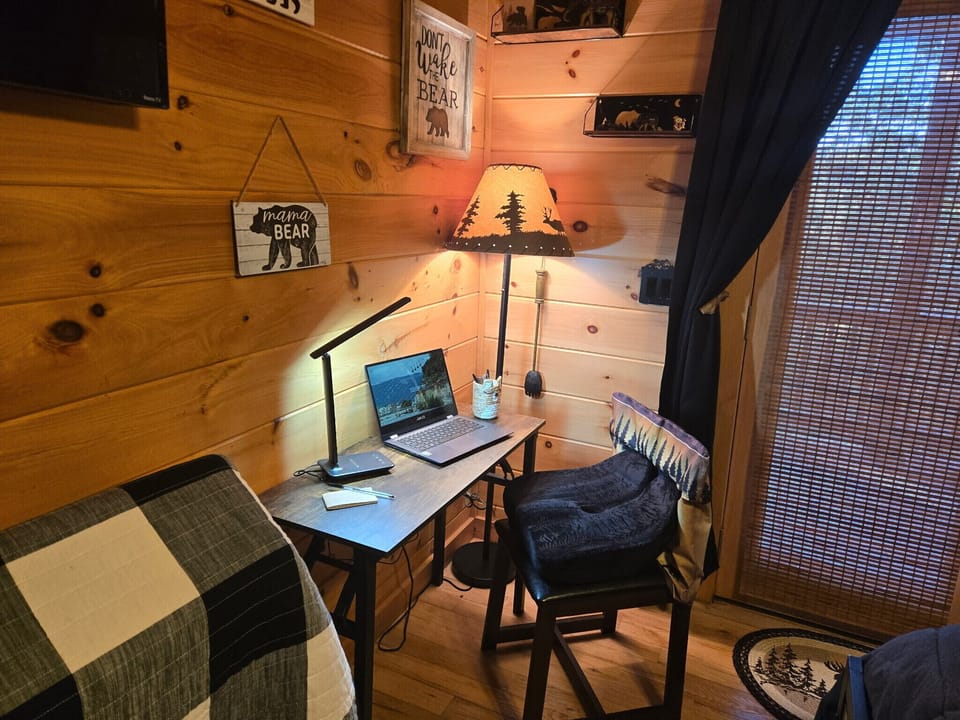 dedicate workspace has desk that can be easily folded up and moved to other rooms depending on who has work to do