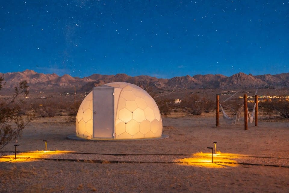 A glowing desert dome beneath endless stars, made for unforgettable nights under the Joshua Tree sky.