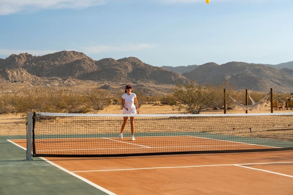Private pickleball court surrounded by Joshua Tree`s iconic landscape.
