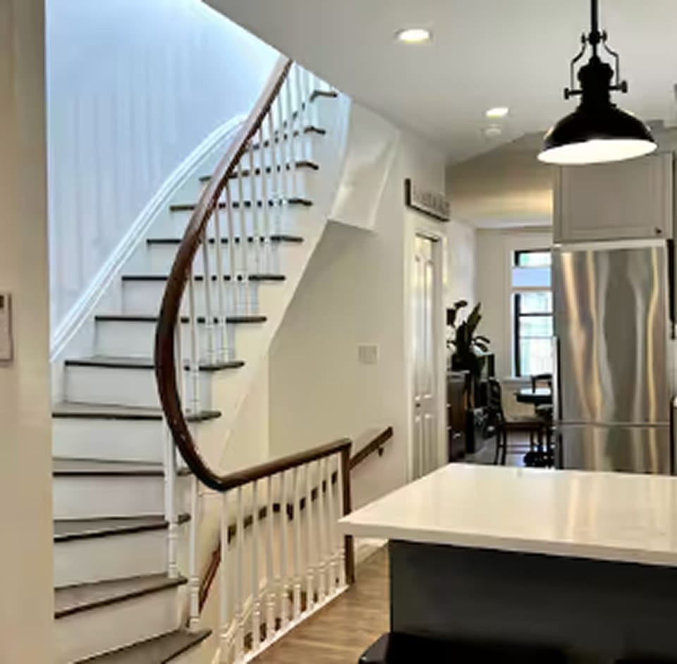 Vintage staircase from 1901 adds charm to your stay.