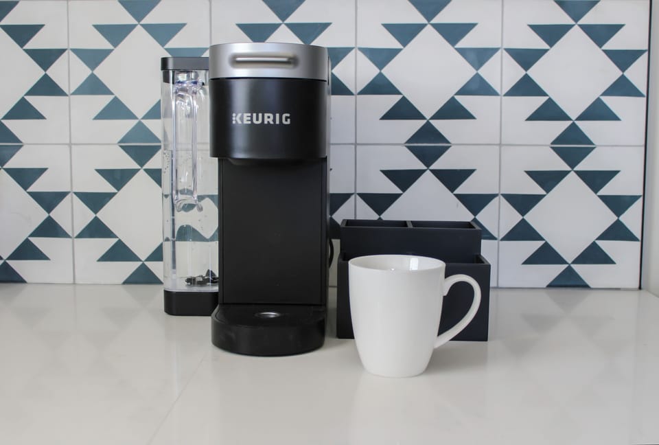 Brew the perfect cup of coffee with complimentary pods, cream, and sugar. 