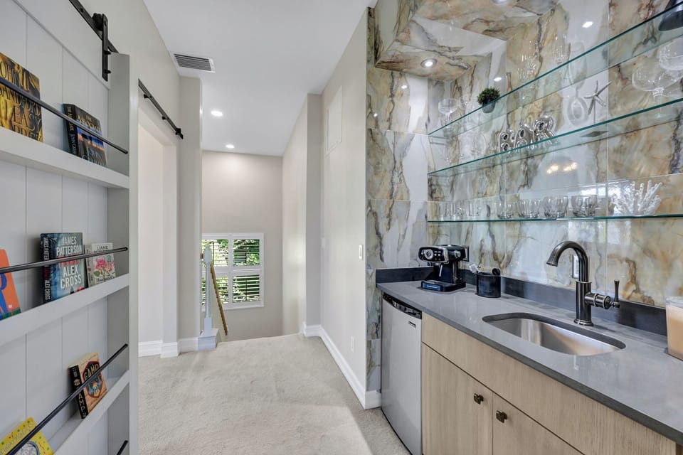 Upstairs espresso bar and barn-door access to fourth bedroom—extra space and convenience for families