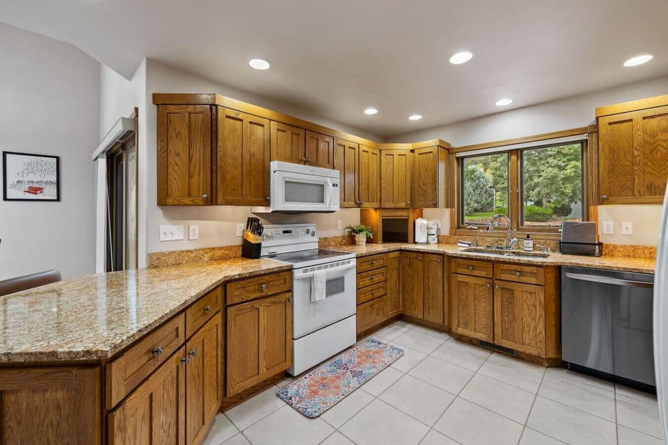 A fully-equipped kitchen with modern appliances, ample storage, and everything needed for convenient cooking and dining.