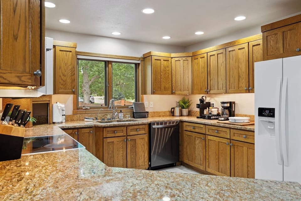 A fully-equipped kitchen with modern appliances, ample counter space, and all the essentials for cooking and dining.