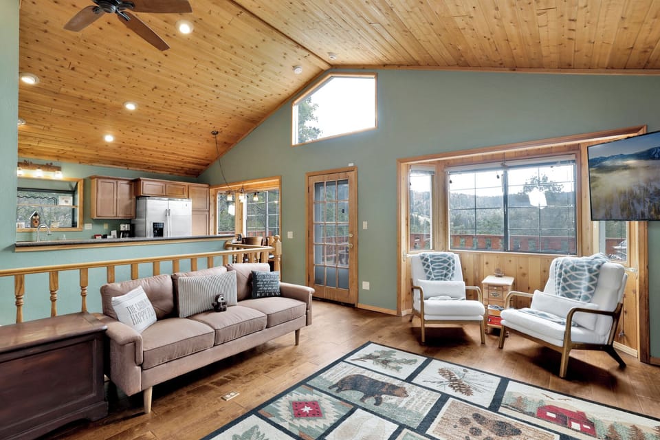 Charming living room with a cozy fireplace, warm ambiance, and inviting layout—perfect for gatherings, relaxation, and enjoying scenic views together