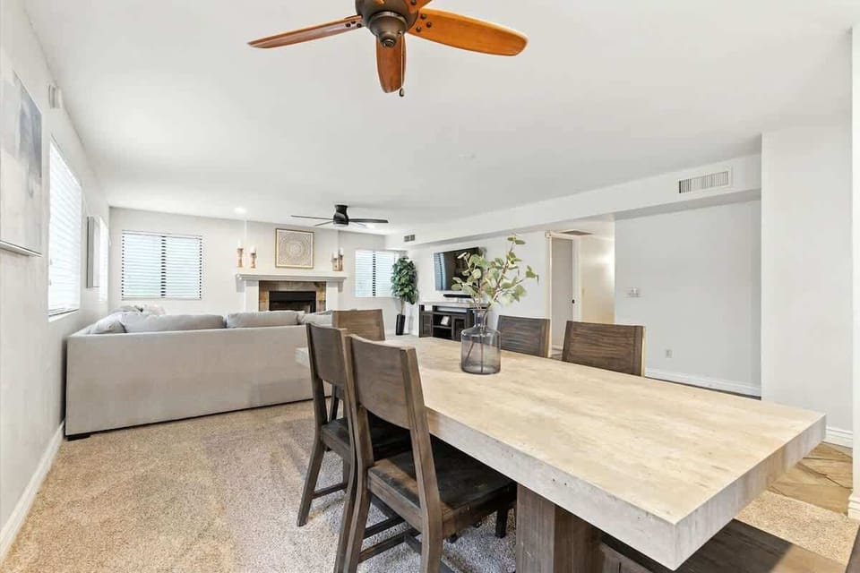 The second dining area provides seating for six, offering a comfortable spot for family meals, game nights, or extra gathering space.