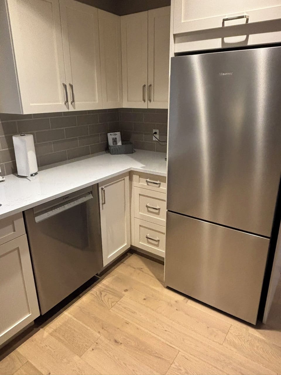 Brand new high end stainless steel appliances in a fully equipped kitchen