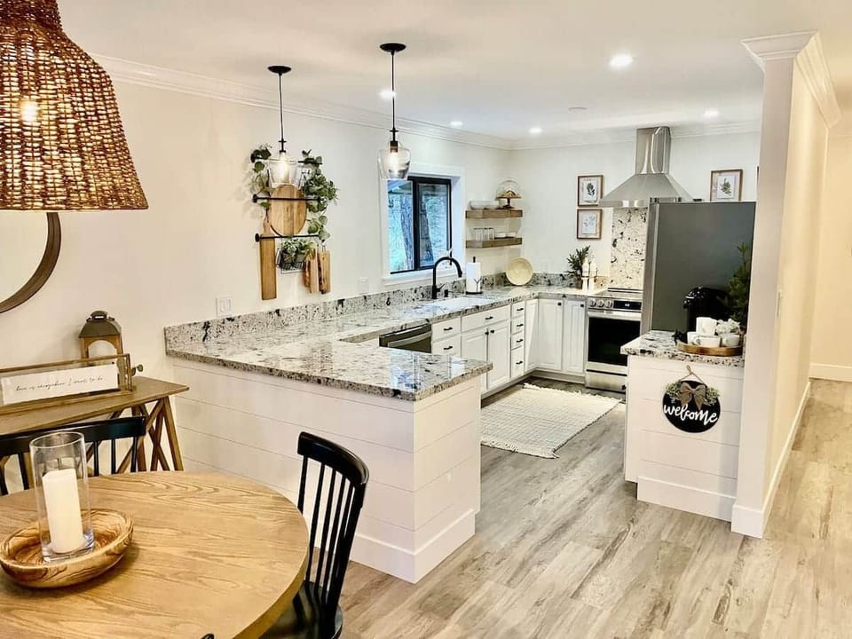 Kitchen – Fully stocked with granite counters and modern appliances.