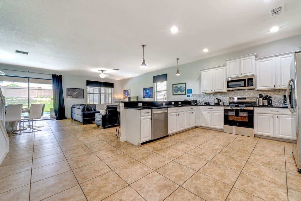 Where the heart of the home meets open living—our kitchen, dining, and living areas flow seamlessly together.