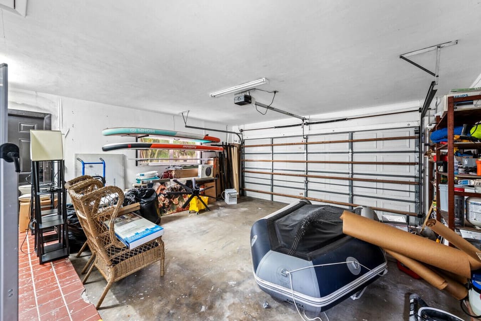 Multi use garage loaded with adventure gear organized spaces bright lighting