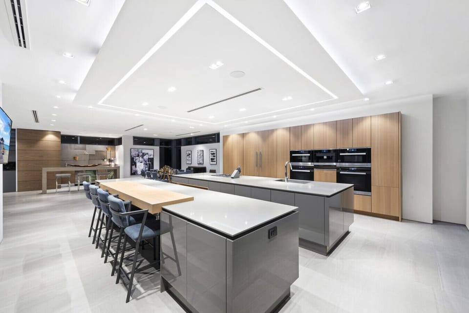 Entertainer’s kitchen offering double prep islands, seating for gatherings, and high-end appliances