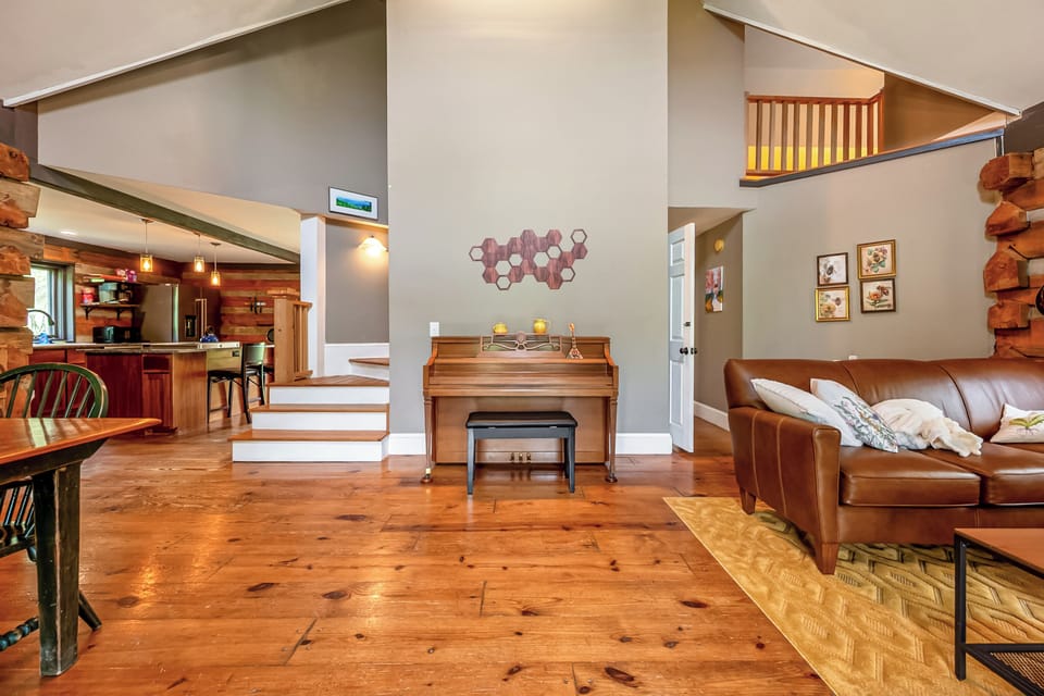 Piano Area – Unique space with piano and cozy seating.
