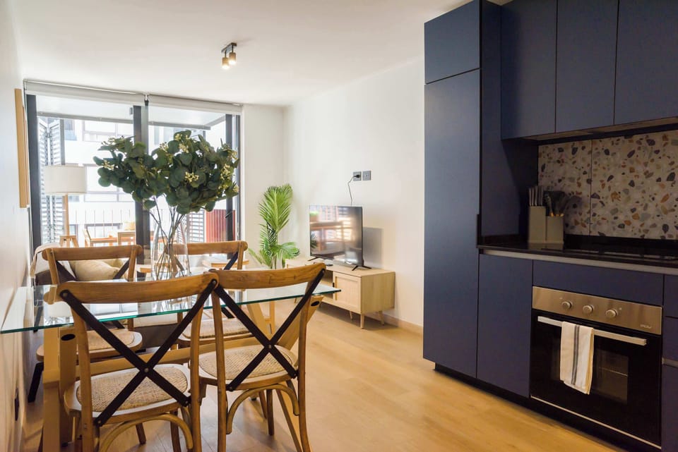Bright and stylish living area with modern kitchen, perfect for relaxation and entertainment.