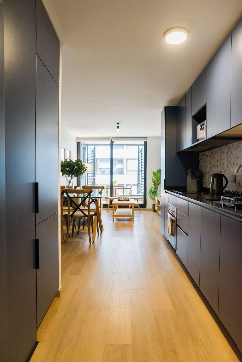 Bright and modern kitchen with sleek design, perfect for cozy meals and gatherings.