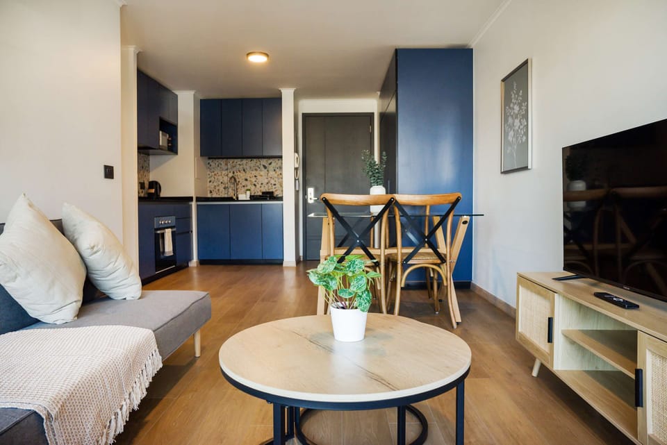 Modern living space with sleek kitchen and cozy seating, ideal for unwinding after city adventures.