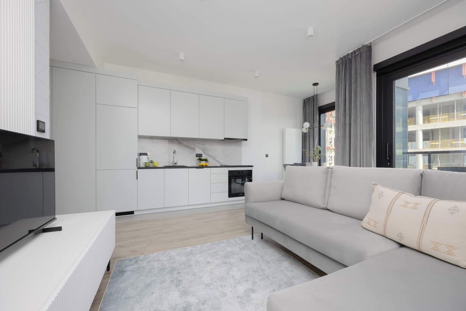 The living room combined with the kitchen creates an open space perfect for both relaxation and spending time together.
