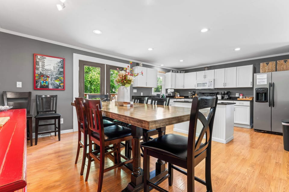 Spacious dining table with seating for 8, perfect for meals and conversation