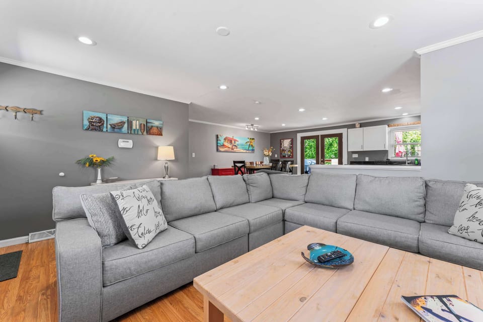 Step into a bright living room with a cozy sofa and smart TV for relaxing nights