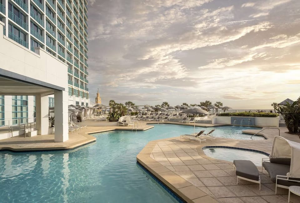 Unwind poolside as golden light dances on the water.