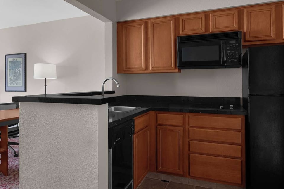 Cook simple meals with a full-size fridge and microwave.