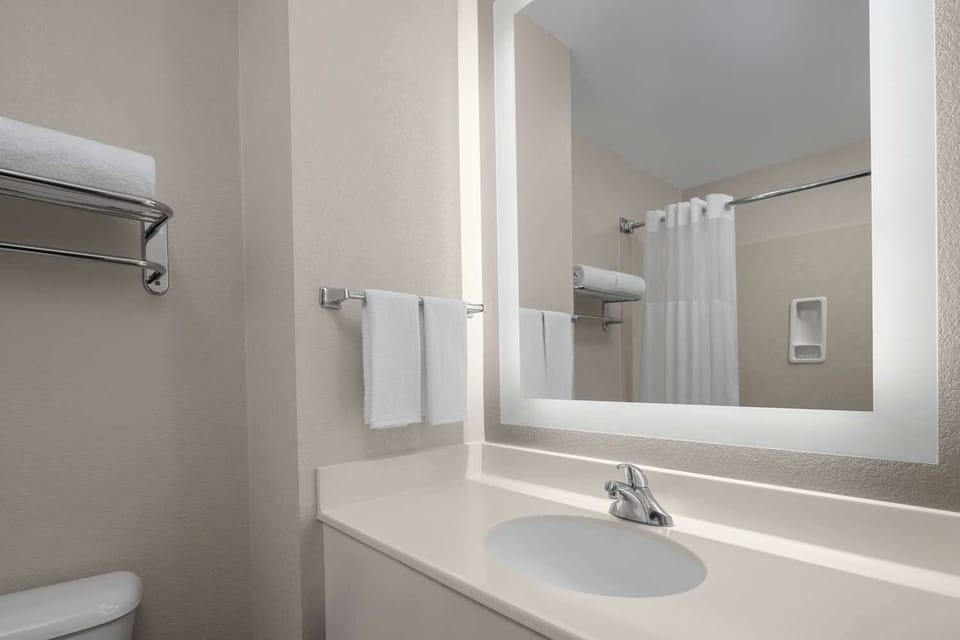 Refresh each morning with a clean vanity and bright mirror.