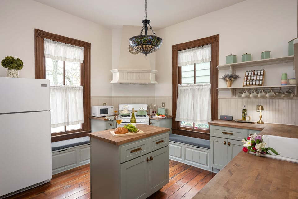 Tiffany style stained glass chandelier & cozy window seats
