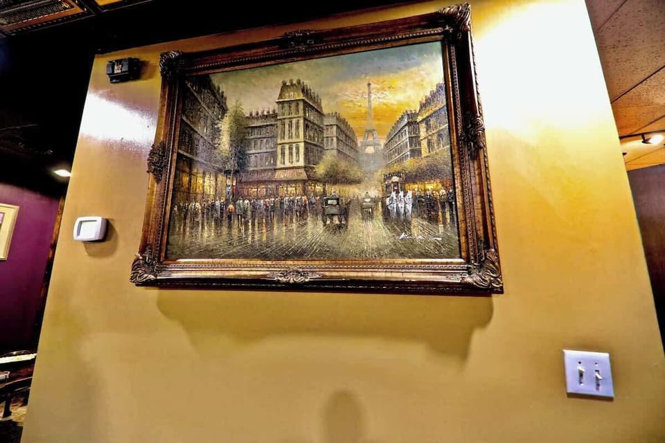 Oil Painting facing featuring La Tour Eiffel down Les Champs-Élysées in Paris. Painted between 1910-1940.