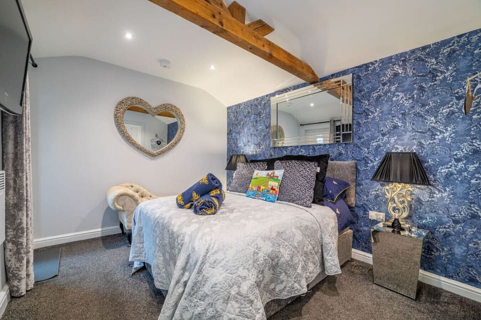 Soft double bed with warm lighting and textures