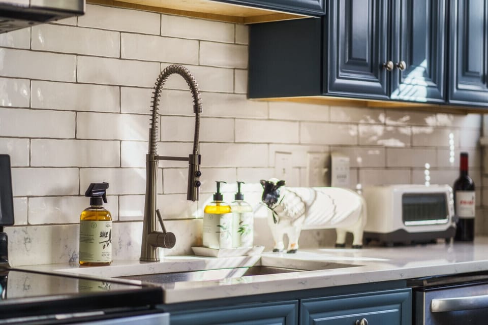 Sleek and modern appliances in our newly remodeled kitchen with all the vintage charm!