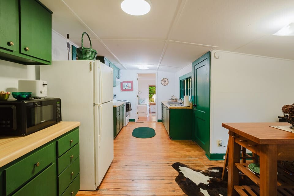 Full kitchen | Appliances | Cozy Dining Table in Center | Open Layout with Easy Flow to Living Area