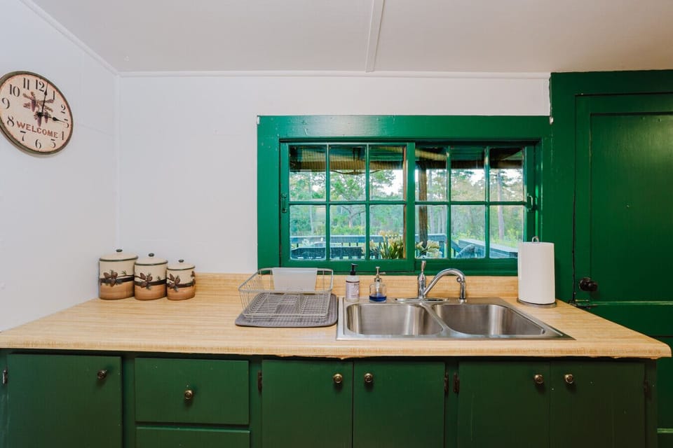 Full kitchen | Appliances | Cozy Dining Table in Center | Open Layout with Easy Flow to Living Area