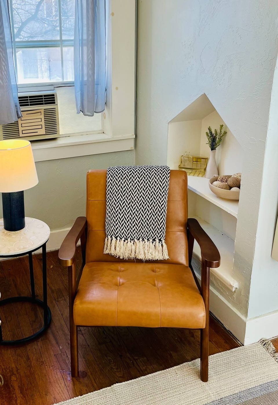 Charming window nook offering a peaceful spot to unwind.