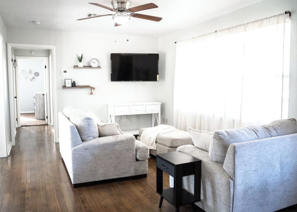 Inviting living room with smart TV and plenty of comfort.