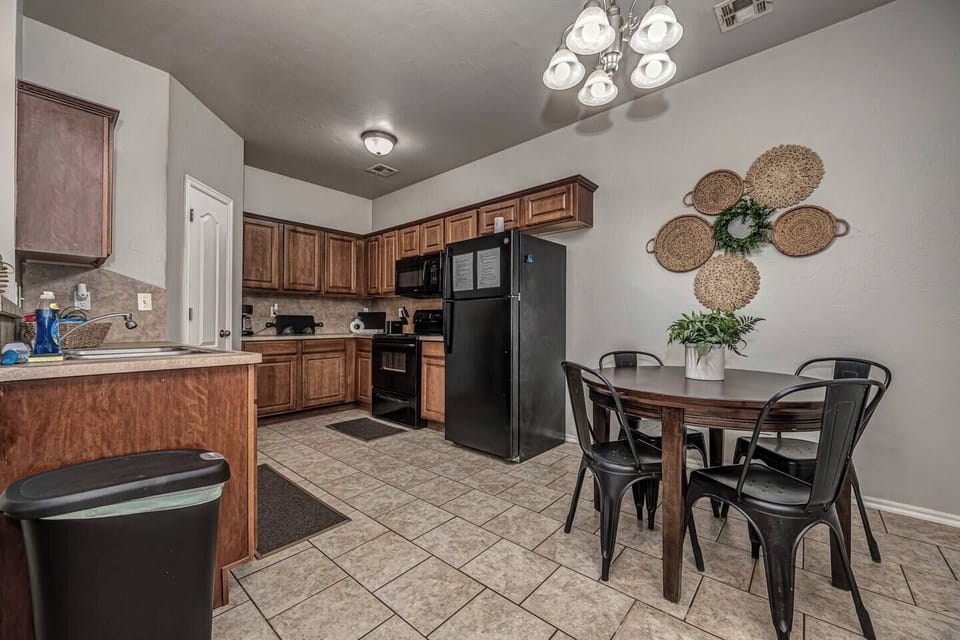 Spacious kitchen with seating for four—perfect for meals or game nights.