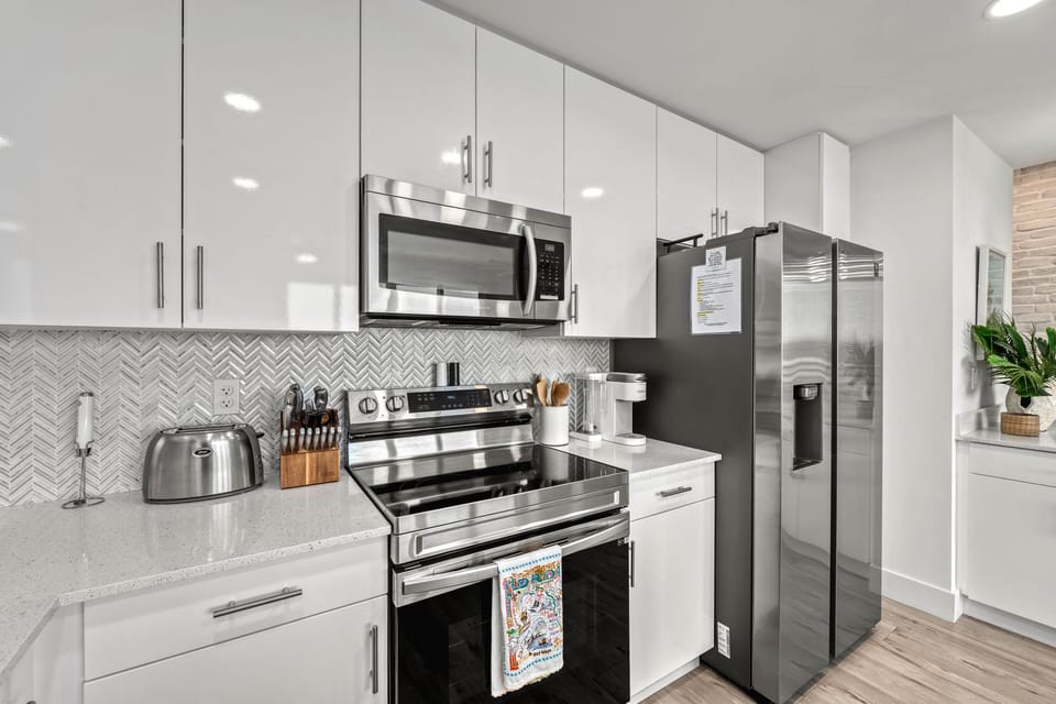 Stainless steel appliances, modern fixtures, and thoughtful touches make every meal feel effortless.