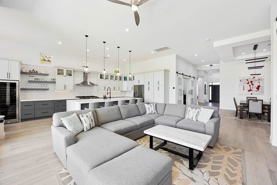 The expansive living room features a comfortable couch sure to reel everyone for cozy movie nights.