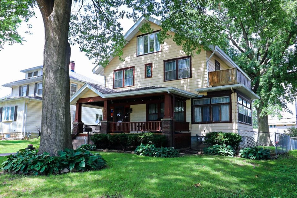 Inviting home with a spacious covered front porch, fully fenced yard, and free street parking. Tucked in a quiet, safe neighborhood with sidewalks for easy walks, plus optional garage parking in back for added convenience.