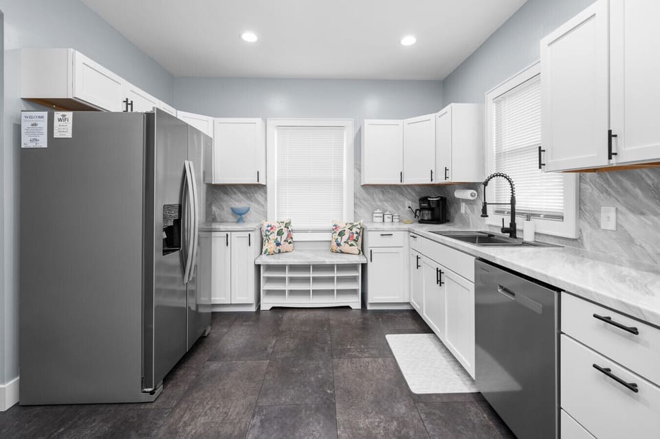 Fully renovated, modern kitchen with stainless steel appliances, extra-large refrigerator, and ample counter space. Enjoy thoughtful touches like a coffee maker and rice cooker, making it easy to prepare meals and feel at home during your stay.