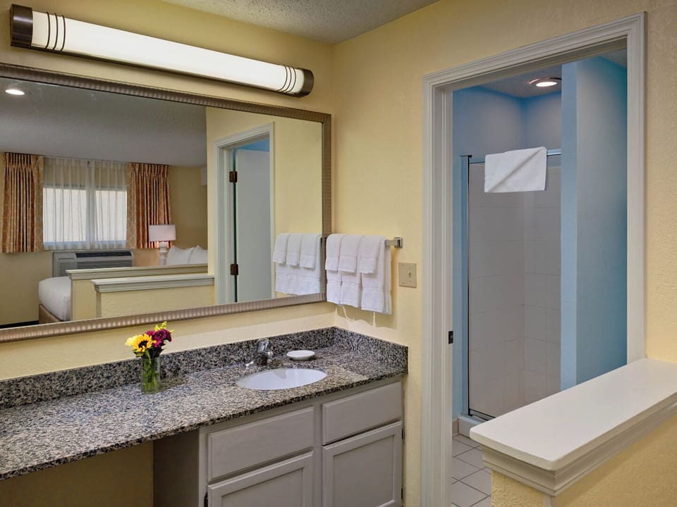 Refresh easily with a roomy vanity and bright, clean shower.