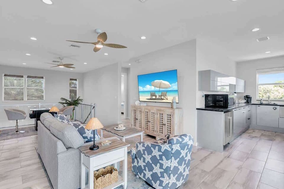 Upper level sitting area and wet bar water front views