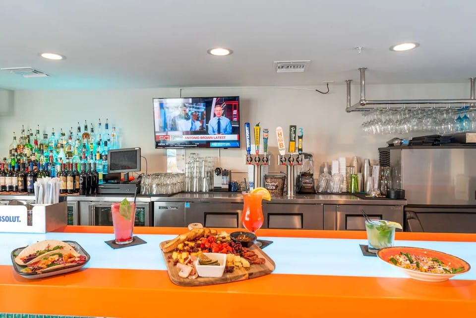 Sip handcrafted cocktails and snack casually at the vibrant bar.