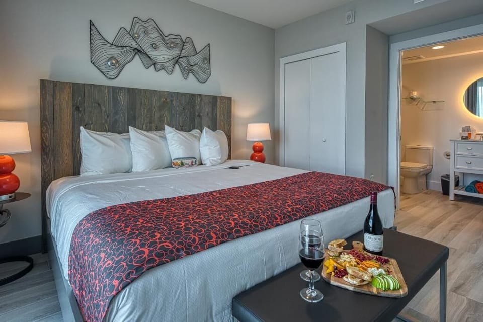 Settle into plush bedding with warm lamps and relaxed vibes.