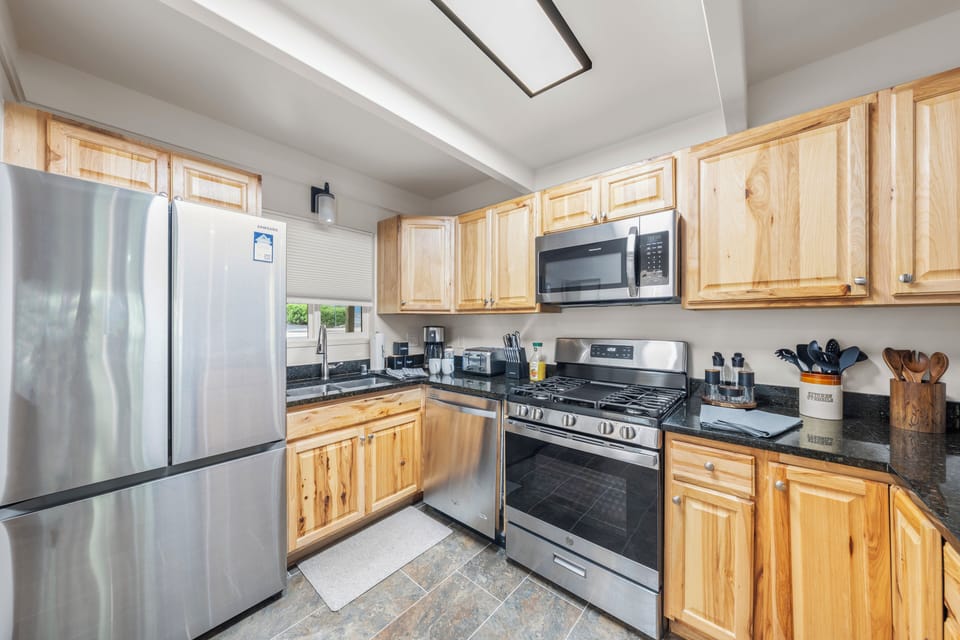 Fully stocked with appliances and utensils.