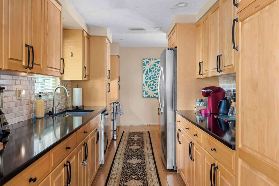 View of kitchen looking towards the back of the house